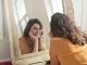 Photo of Woman Looking at the Mirror